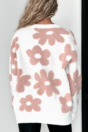 Back view of white knit top with pink flower pattern