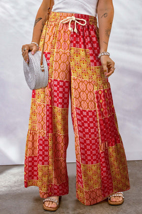 Red and orange printed wide leg pants with drawstring