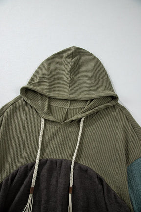 Close-up of waffle-knit hooded top with drawstrings