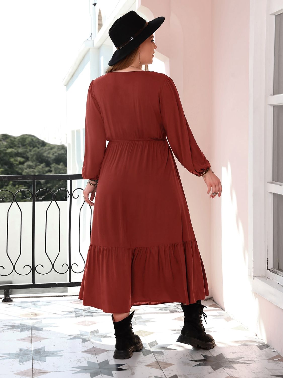 Back view of rust V-neck long sleeve plus size dress.