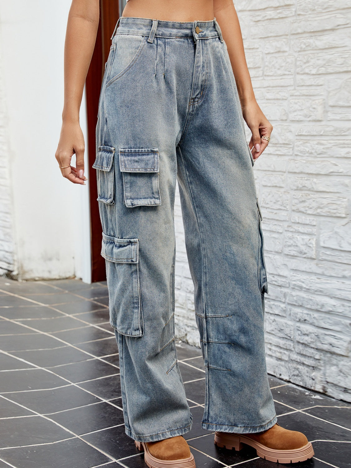 Side view of washed cargo jeans with pockets