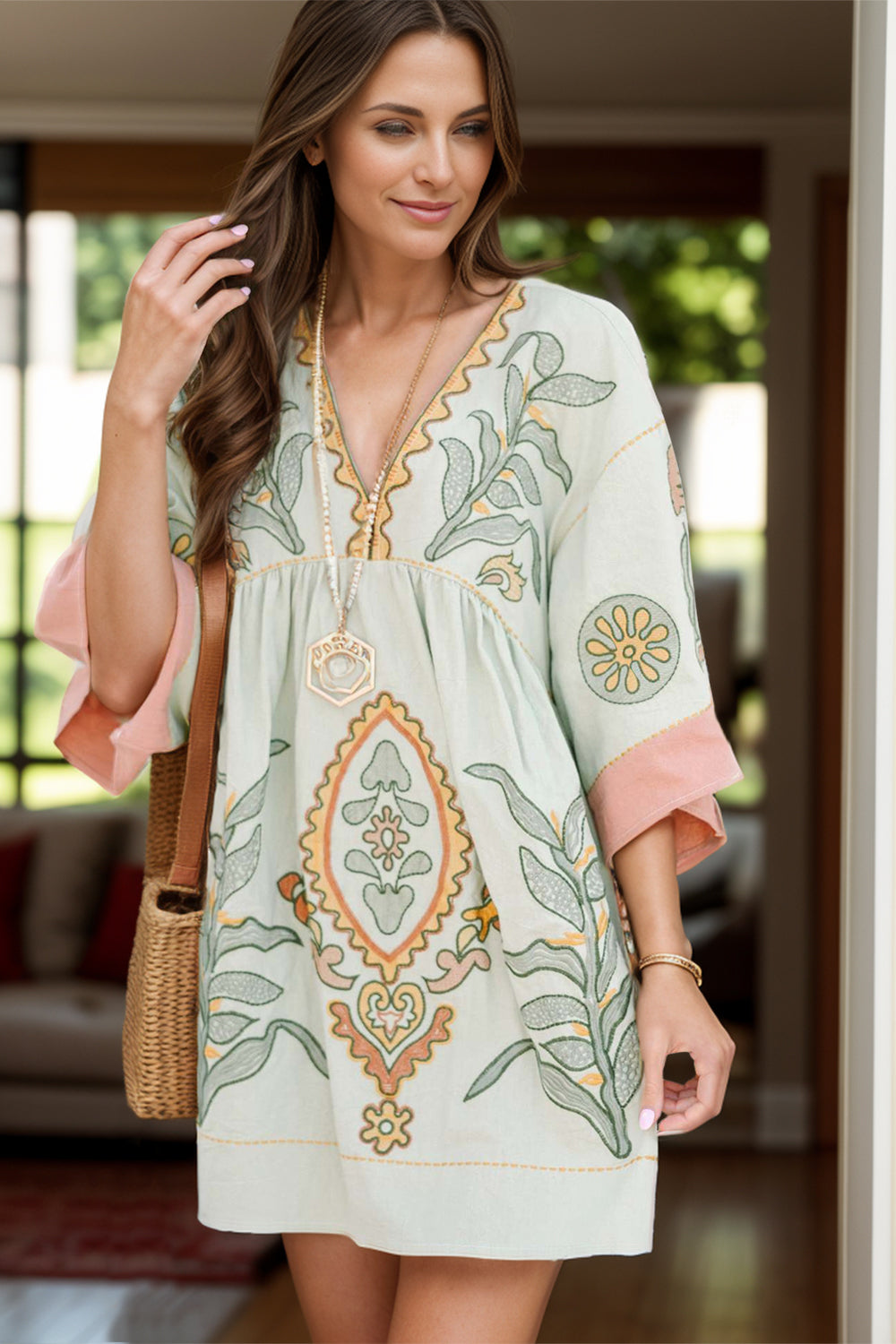 Light green floral printed V-neck mini dress with peach trim