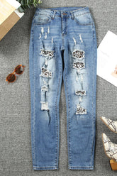 Front view of leopard distressed pocketed straight jeans