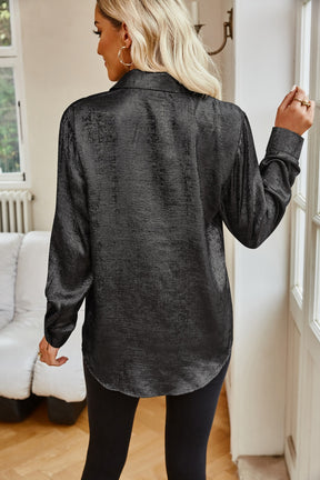 Black pocketed collared neck long sleeve shirt, back view