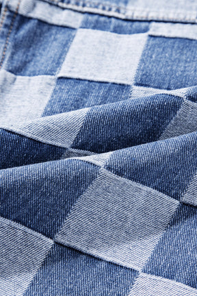 Close-up of checkered denim fabric texture.