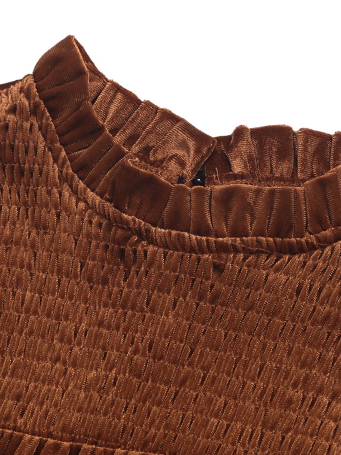 Close-up of ruched mock neck detail on caramel mini dress