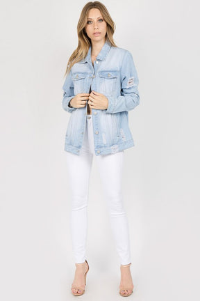 Front view of light blue distressed denim jacket