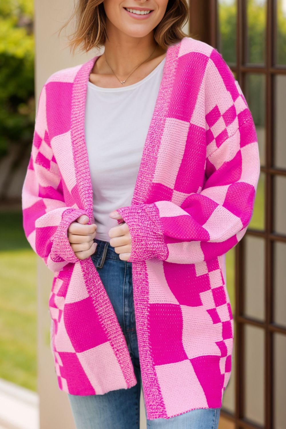 Pink checkered open front long sleeve cardigan, front view