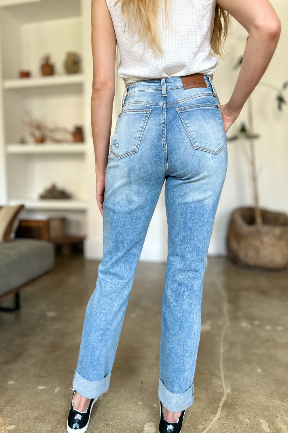 Back view of Judy Blue distressed jeans with patch pockets.