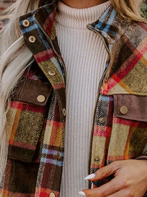 Close-up of plaid pattern on long sleeve jacket