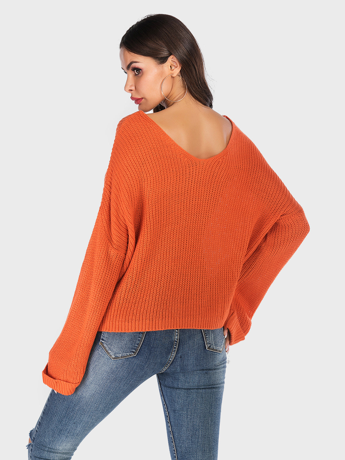 Orange V-neck dropped shoulder sweater, back view