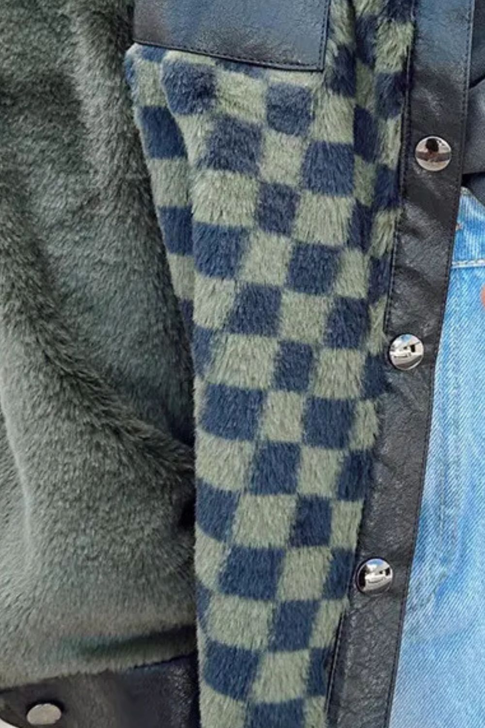 Close-up of checkered pattern on collared neck jacket.