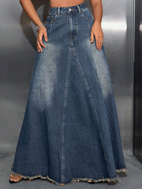 a woman wearing a denim skirt and crop top