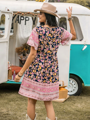 Back view of printed V-neck short sleeve mini dress