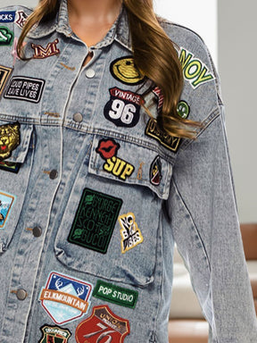 Close-up of embroidered patches on denim jacket.