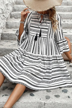 Stylish tie neck mini dress with black and white print