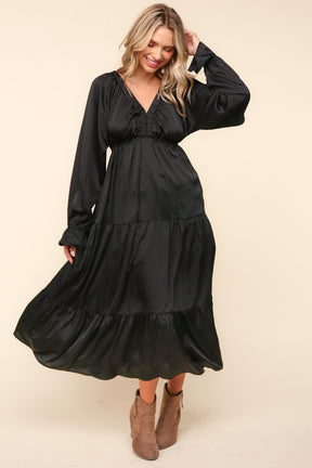 Elegant black tiered midi dress with flounce sleeves