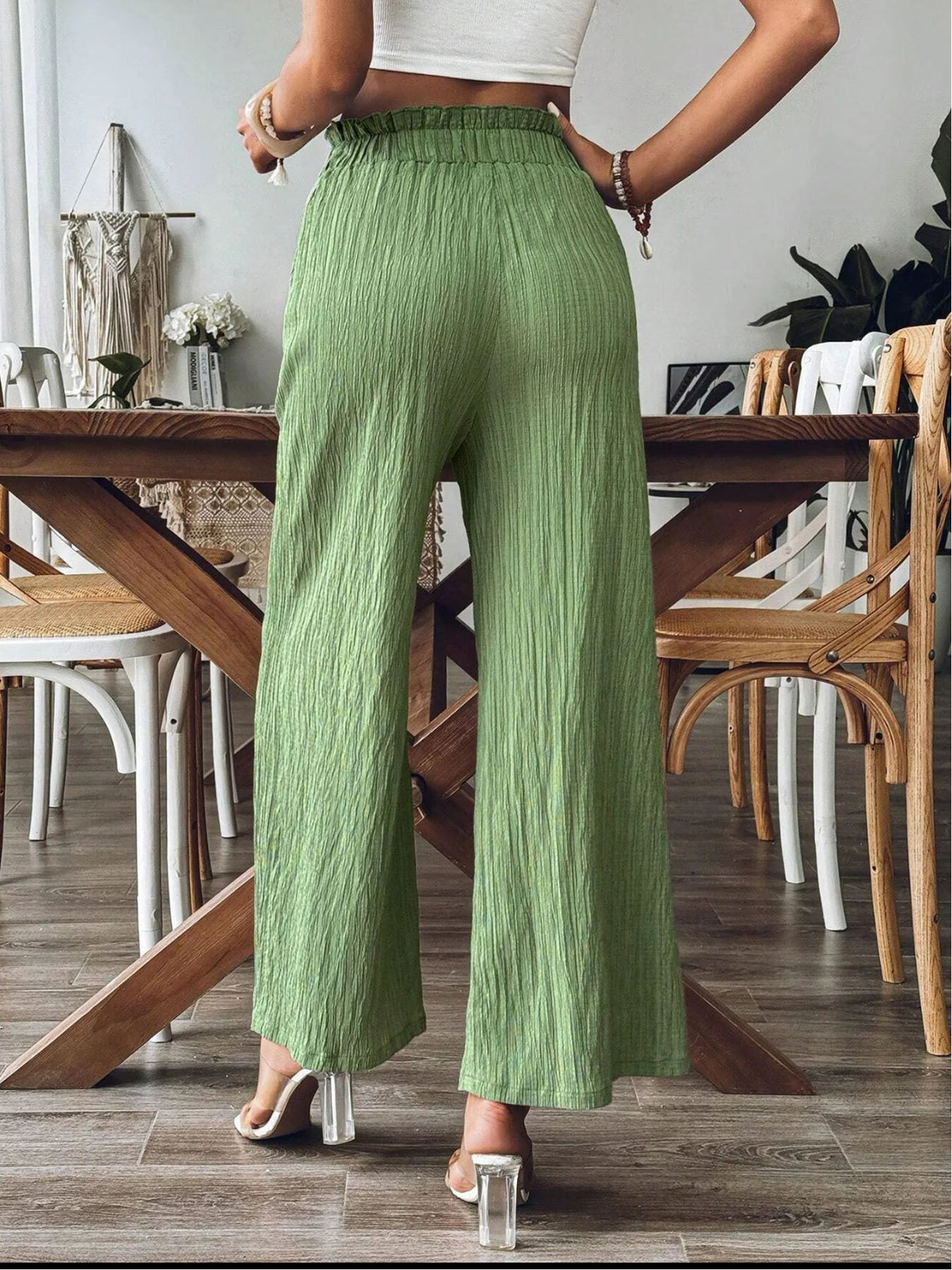 Back view of green wide leg pants with elastic waist