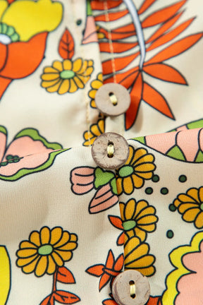 Close-up of floral print and buttons on mini dress