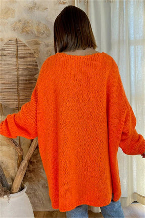 Back view of orange V-neck sweater