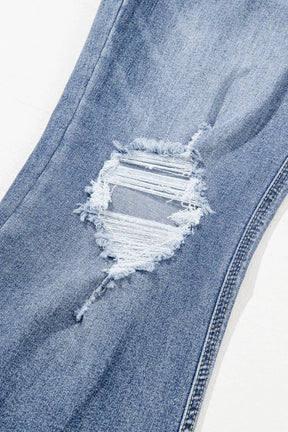 Close-up of distressed detail on raw hem jeans