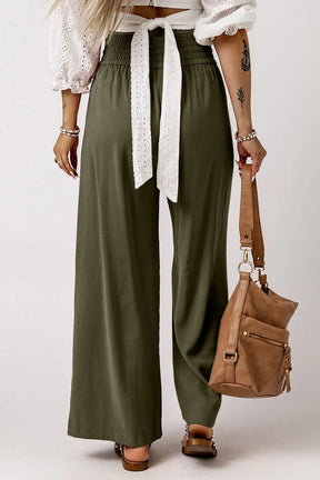 Olive smocked high waist wide leg pants, back view