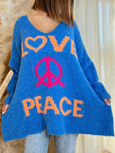 Blue V-neck sweater with peace graphic and love text