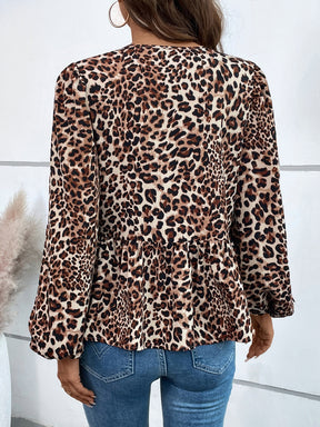 a woman wearing a leopard print jacket and jeans