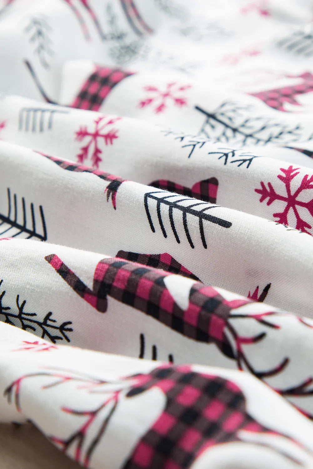 Close-up of boho style printed fabric with reindeer