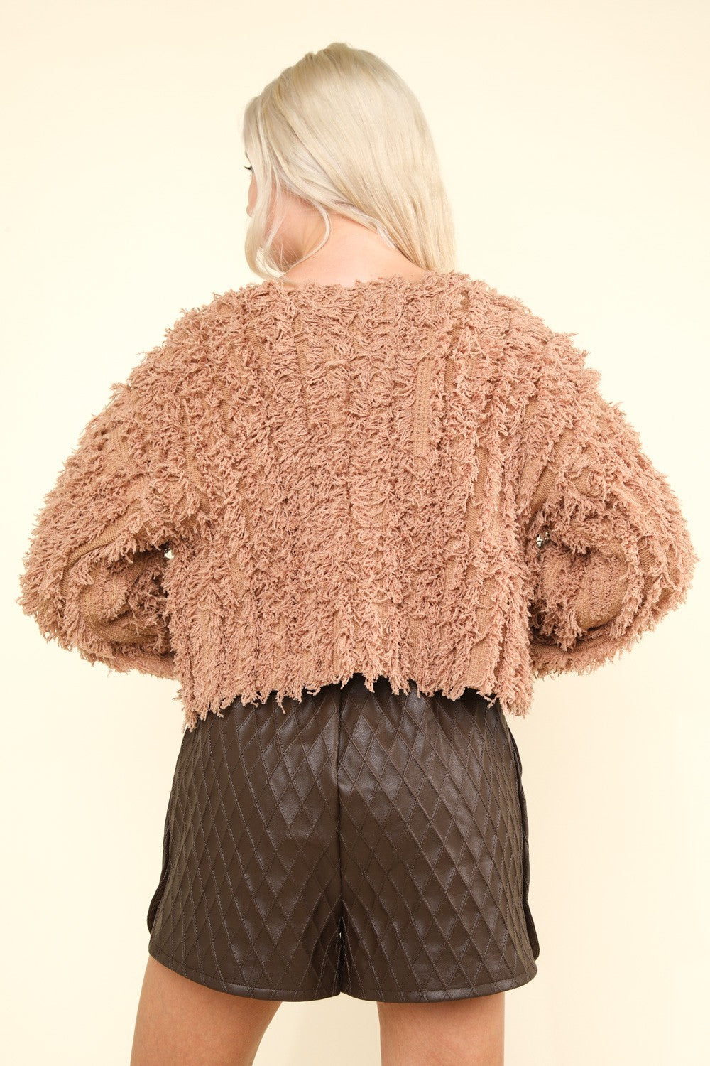 Shaggy yarn knit zip-up jacket in mocha, back view.