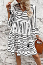 Boho printed tie neck mini dress with three-quarter sleeves