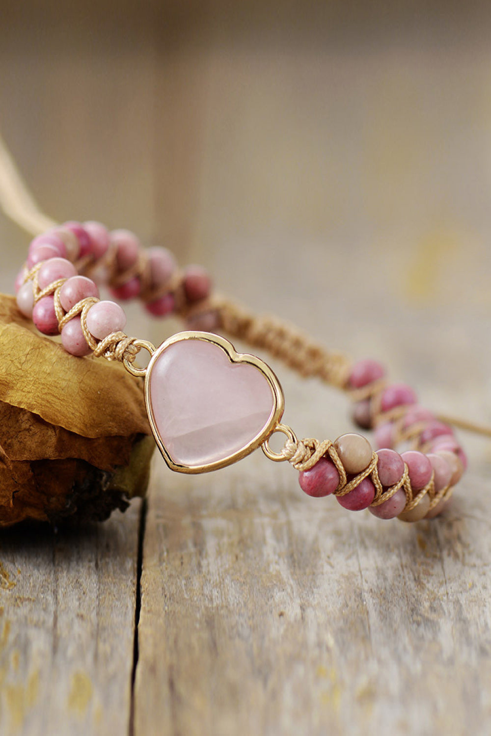 Rose Quartz Heart Beaded Bracelet on wood surface