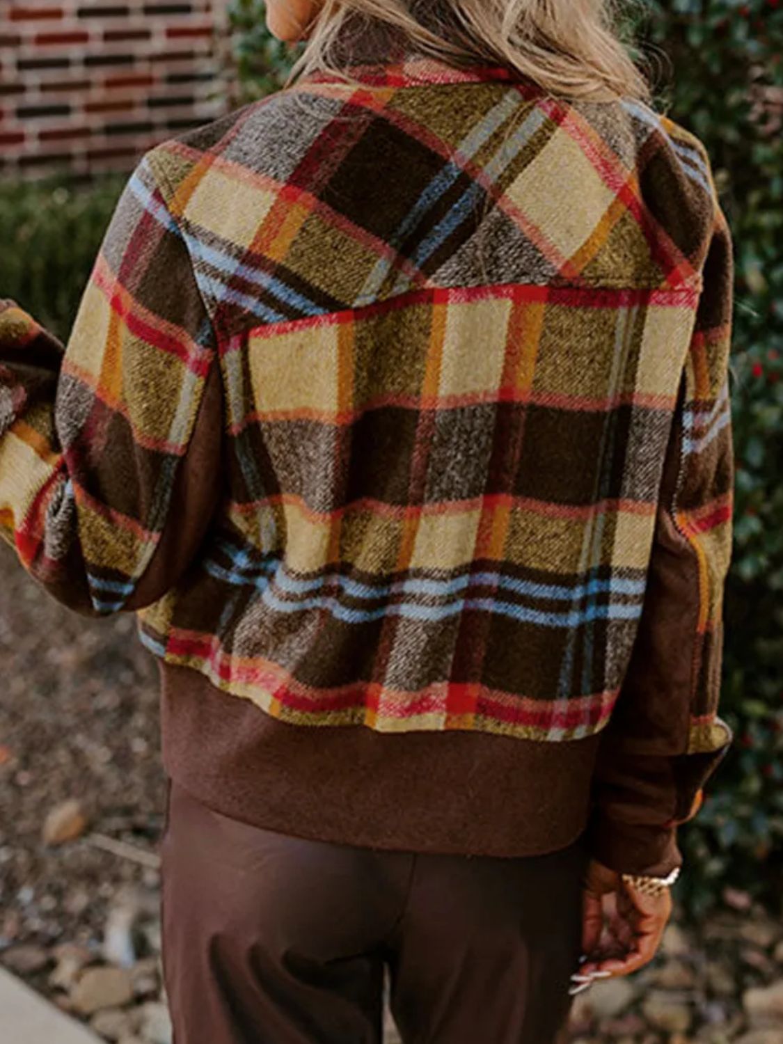 Back view of pocketed plaid long sleeve jacket