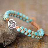 Turquoise beaded bracelet with heart charm on stone