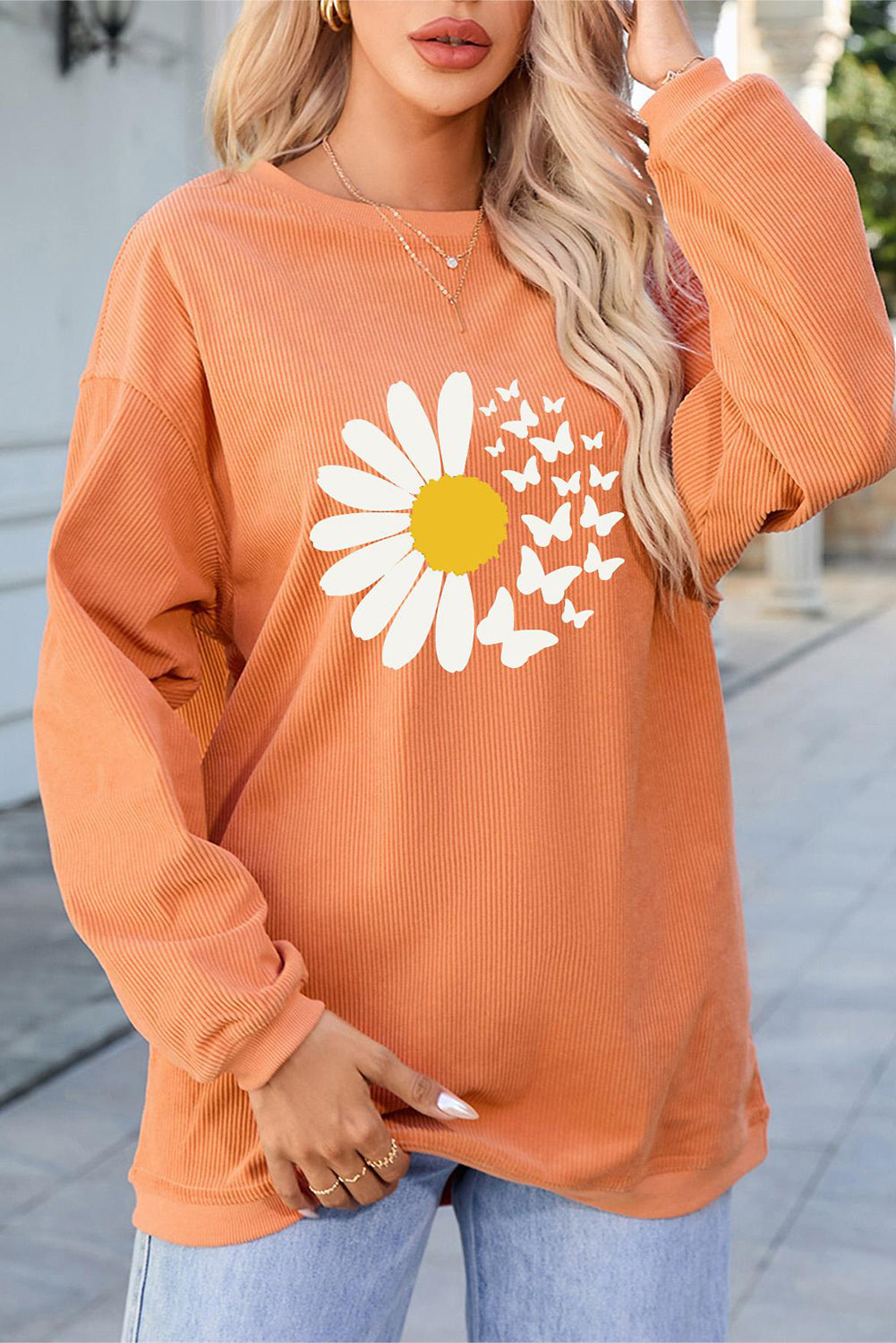 Orange graphic round neck long sleeve sweatshirt with daisy design