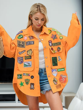 Orange jacket with embroidered patches, front view.