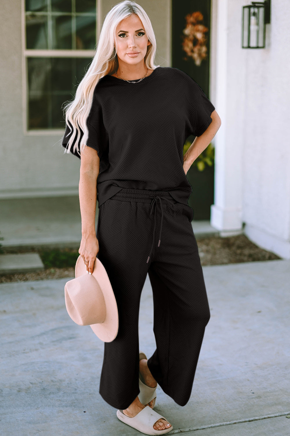 Black short sleeve top and pants set, front view