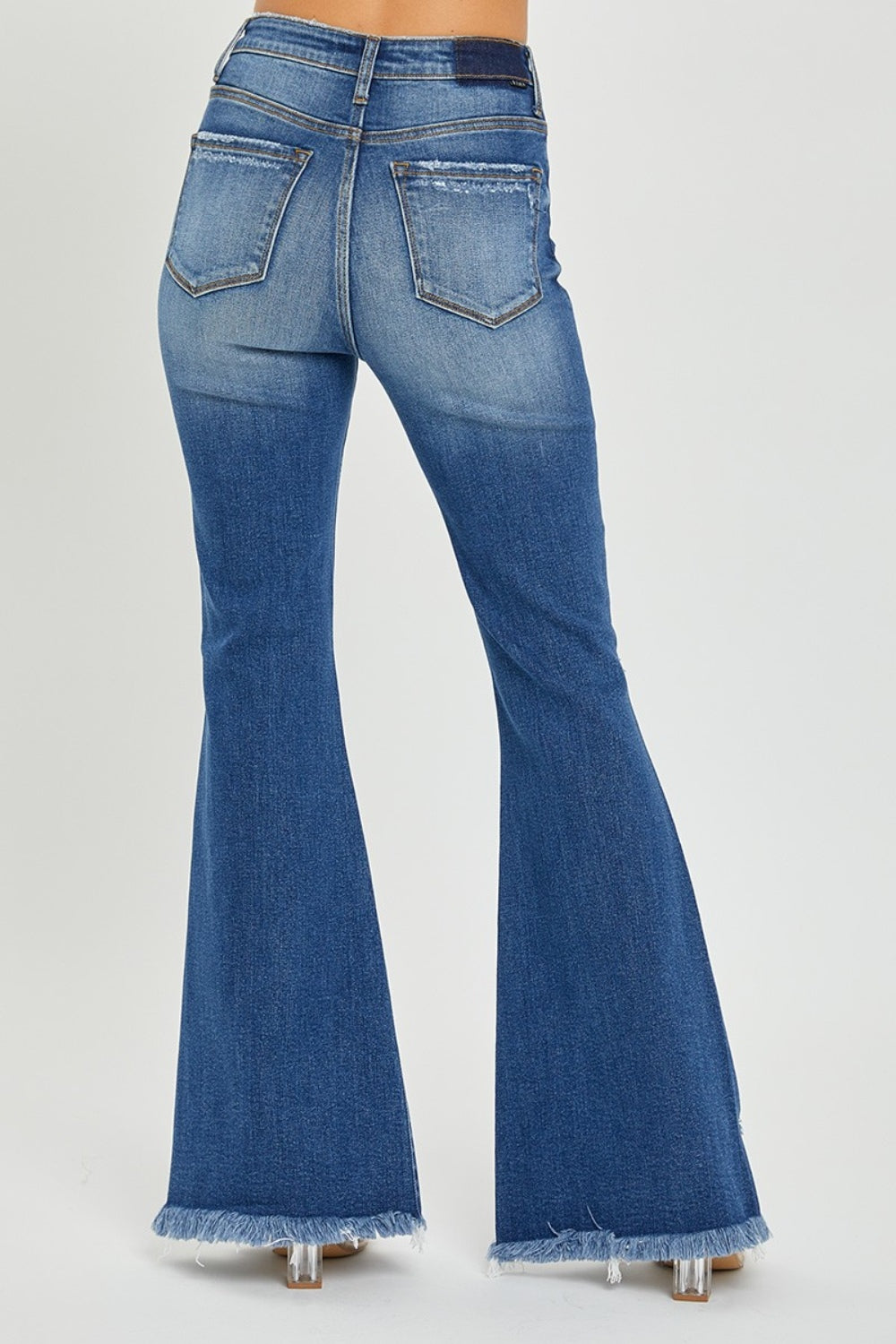 Back view of high rise frayed hem flare jeans