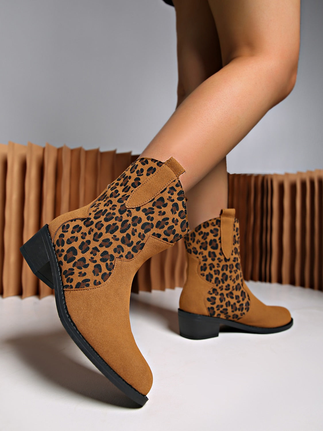 Stylish leopard suede boots with comfortable block heels.