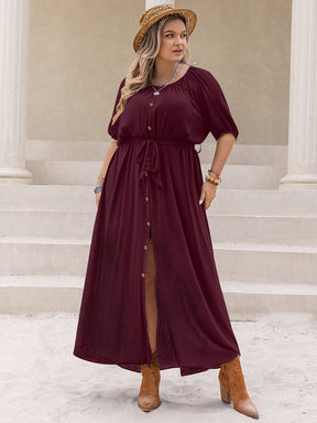 Plus size burgundy dress with round neck and half sleeves.