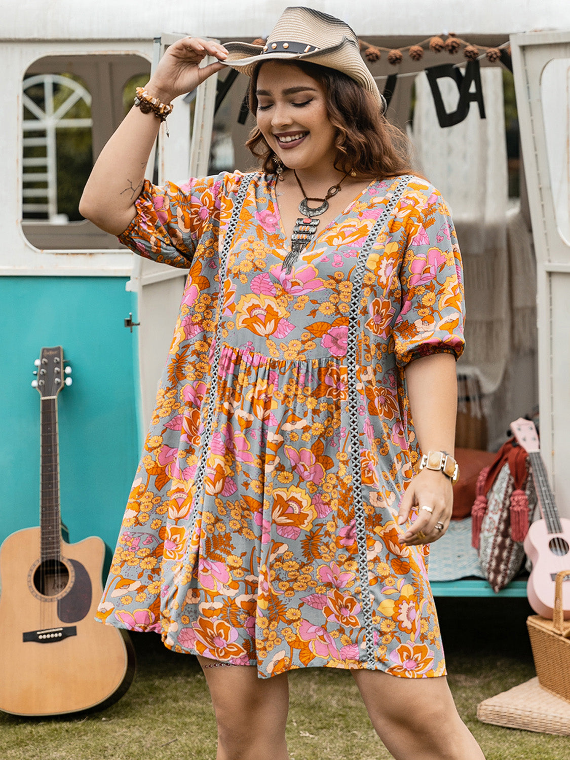 Plus size ruched printed mini dress with half sleeves, front view