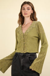 V-neck lace detail crop knit top with bell sleeves, front view