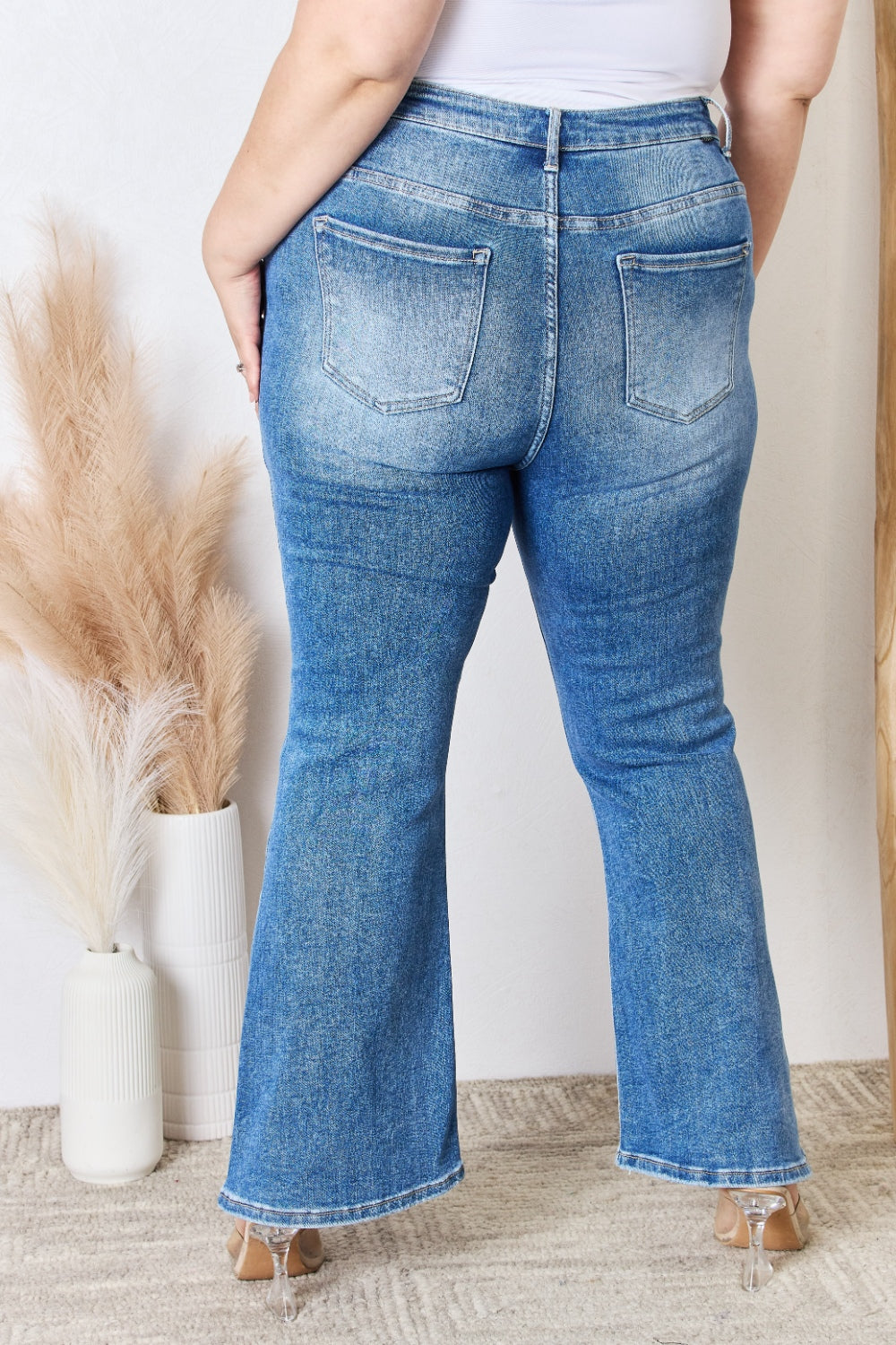 Plus size RISEN high rise ankle flare jeans back view