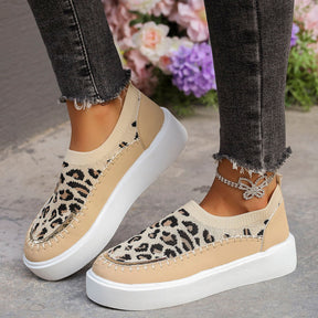 Leopard print platform sneakers with distressed jeans