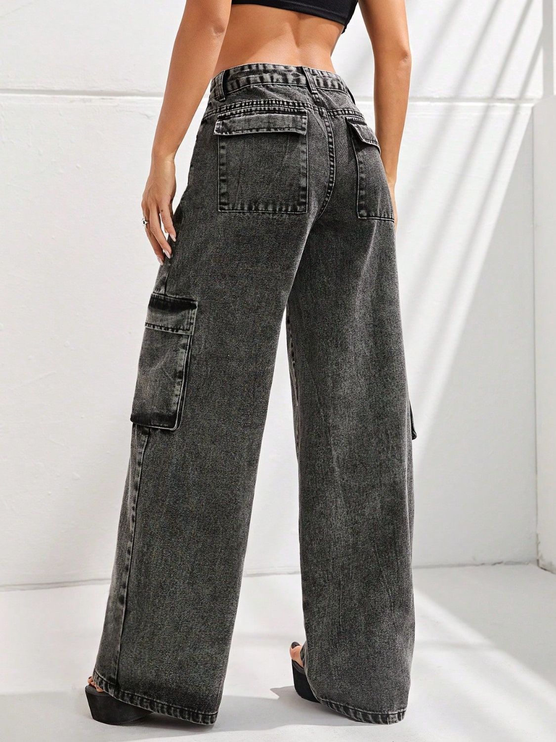 Black wide leg jeans with pockets, back view