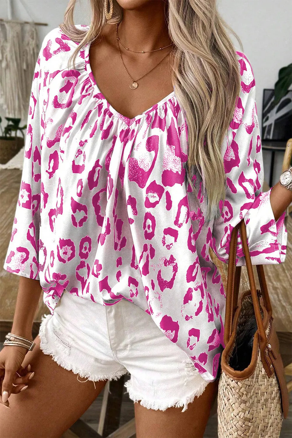 Fuchsia pink leopard V-neck blouse with three-quarter sleeves