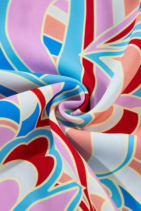 Close-up of vibrant printed fabric with swirling patterns