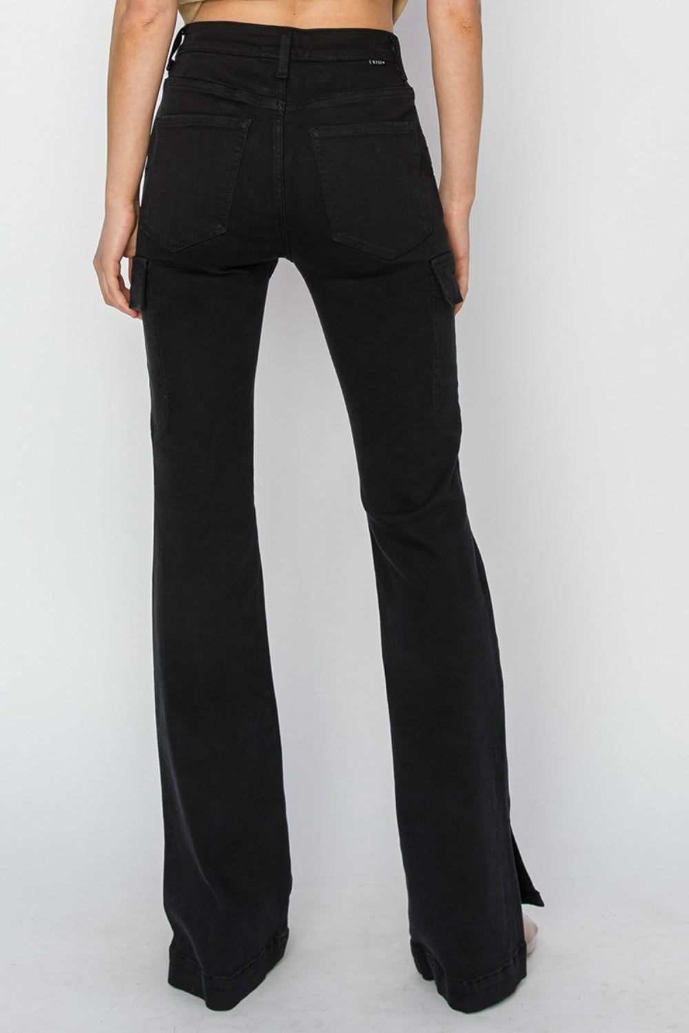 RISEN high-rise black cargo jeans with side slits, back view