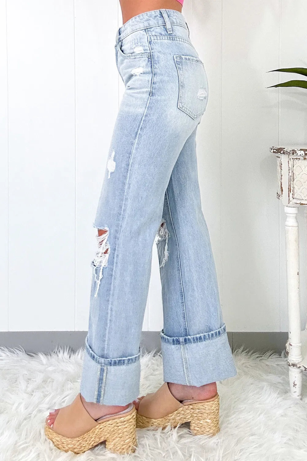 Side view of distressed high waist jeans