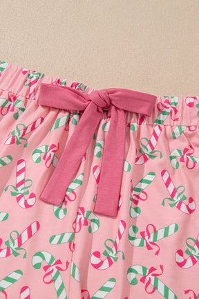 Close-up of pink candy cane shorts with bow detail